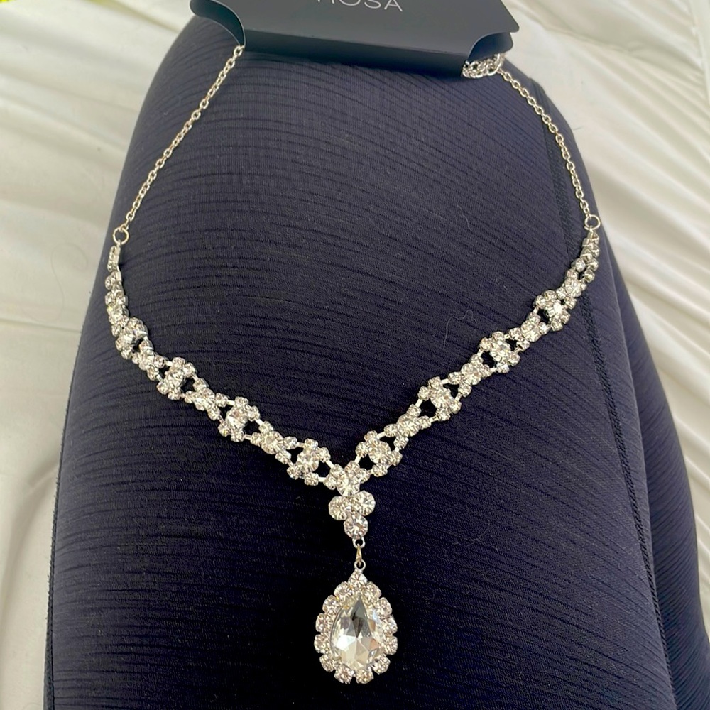 ROSA silver and crystal 20” long necklace with adjustable clasp closure.  NWT